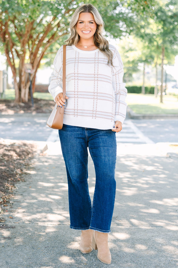 Plus Size ivory crewneck sweater with a tan and blue plaid pattern and long sleeves.