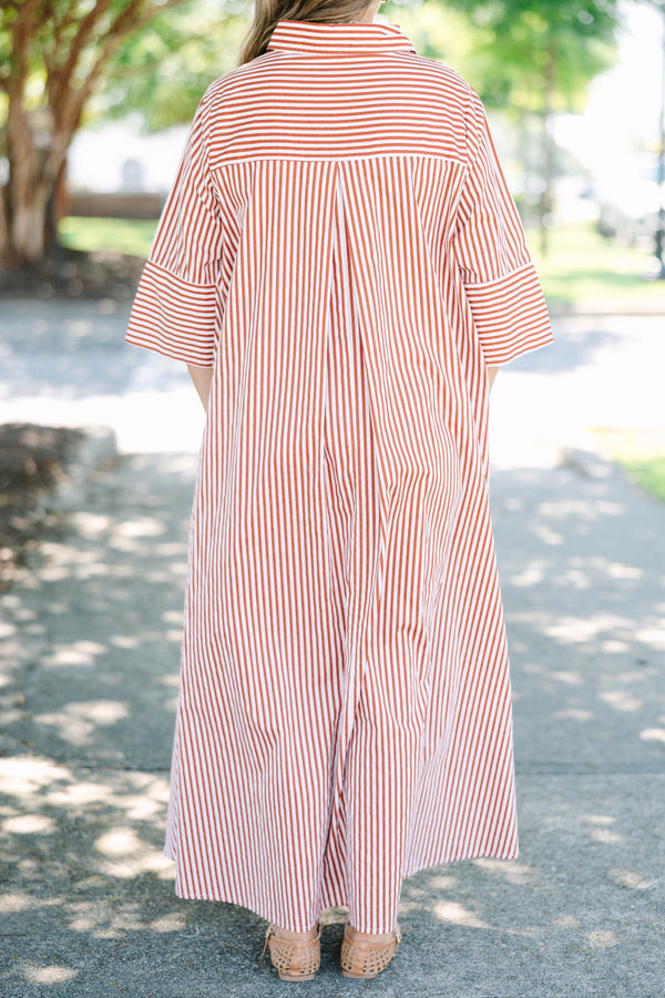 Plus size red and white striped maxi dress with a flowy fit, button-down front, and wide sleeves.