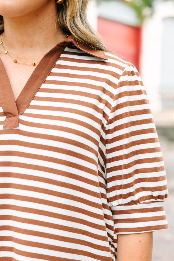 Plus Size brown and white striped popover top with a v-neck collar and short puff sleeves.