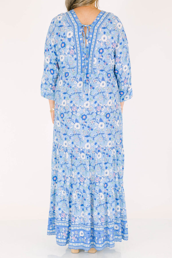 Plus Size blue floral maxi dress with long sleeves, a V-neckline, and tassel drawstring waist.