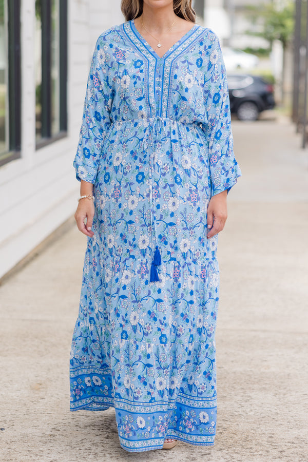 Plus Size blue floral maxi dress with long sleeves, a V-neckline, and tassel drawstring waist.