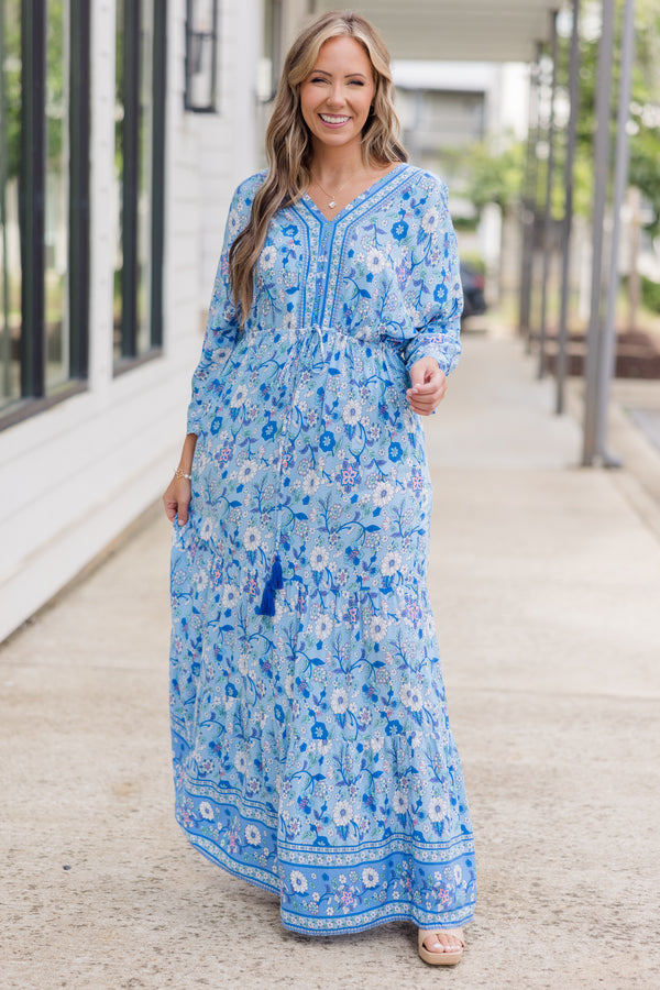 Plus Size blue floral maxi dress with long sleeves, a V-neckline, and tassel drawstring waist.
