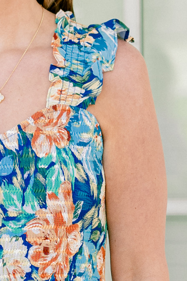 Chic Soul plus size clothing, flutter strap navy blue flowy jumpsuit with wide-legs and a orange and blue floral pattern