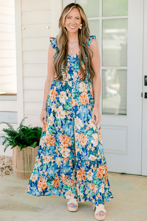 Chic Soul plus size clothing, flutter strap navy blue flowy jumpsuit with wide-legs and a orange and blue floral pattern