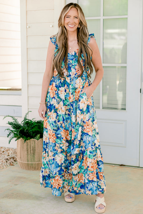 Chic Soul plus size clothing, flutter strap navy blue flowy jumpsuit with wide-legs and a orange and blue floral pattern