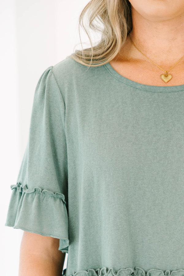 Plus size dusty green babydoll top with ruffle sleeves and hemline