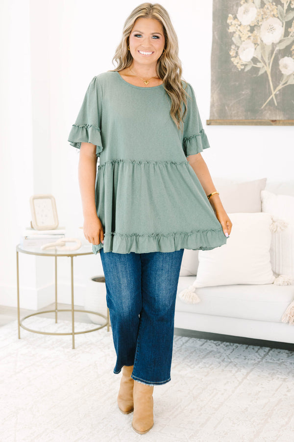 Plus size dusty green babydoll top with ruffle sleeves and hemline