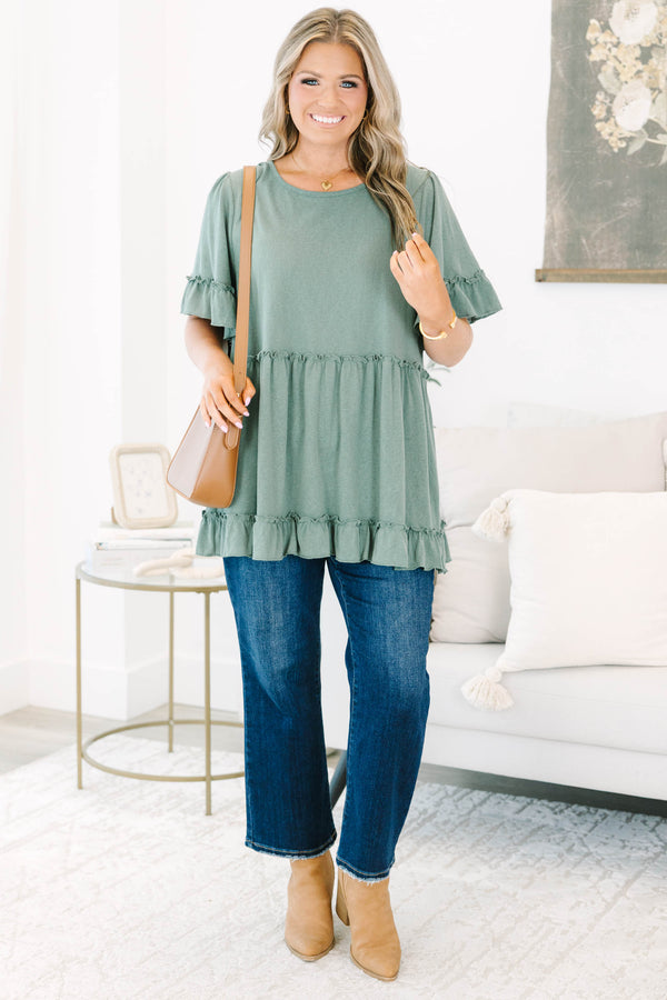 Plus size dusty green babydoll top with ruffle sleeves and hemline