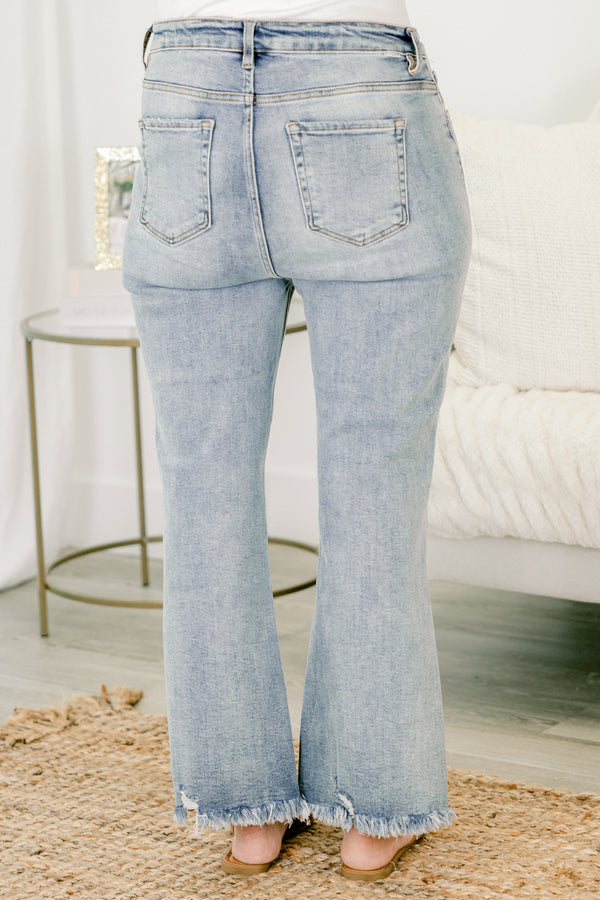   Chic soul plus size clothing, light wash blue jeans with frayed detail on both pant legs 
