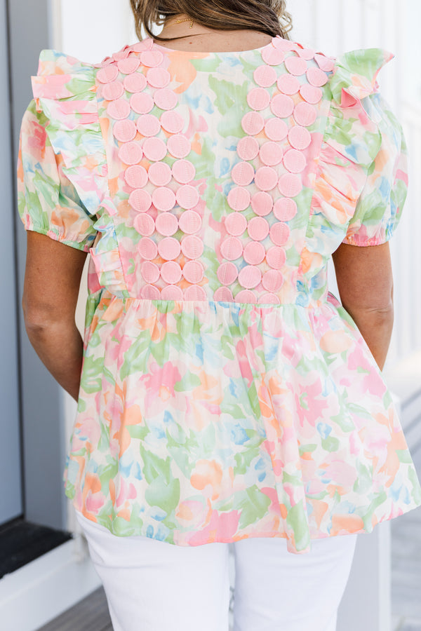 Chic Soul plus size clothing, short-puffed-sleeve pink watercolor baby doll top with a square-neckline and a pink spotted fabric layered on top of the neckline with a subtle watercolor floral pattern 