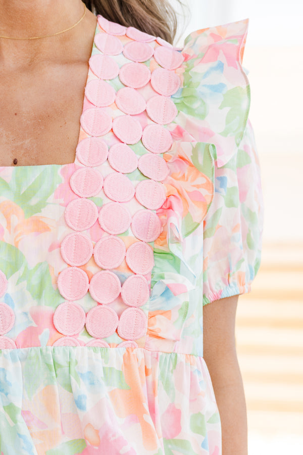 Chic Soul plus size clothing, short-puffed-sleeve pink watercolor baby doll top with a square-neckline and a pink spotted fabric layered on top of the neckline with a subtle watercolor floral pattern 