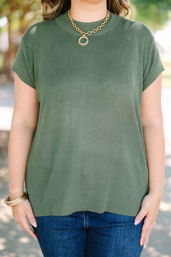 Plus Size olive green short sleeve sweater with a crew neckline and ribbed knit texture.