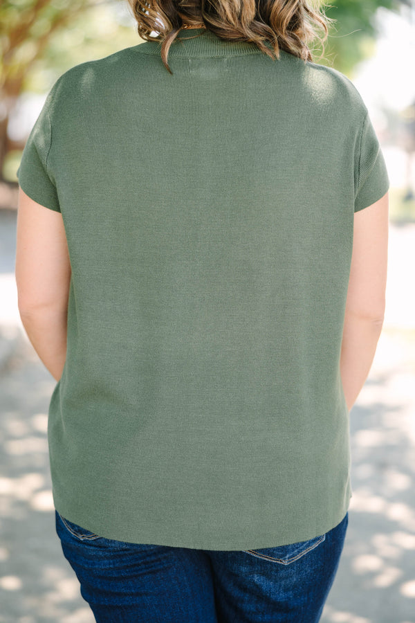 Plus Size olive green short sleeve sweater with a crew neckline and ribbed knit texture.