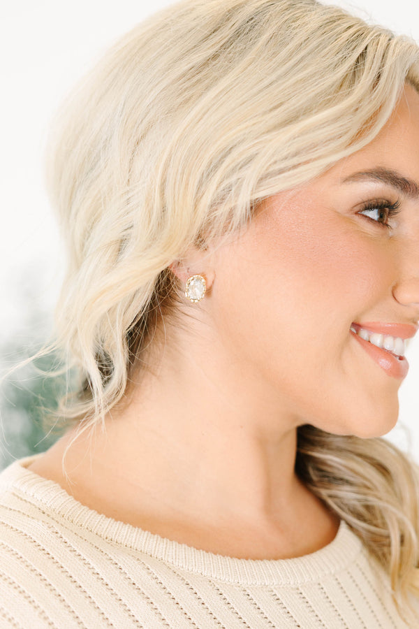 Plus Size oval faceted crystal earring set in a polished gold-plated brass frame.