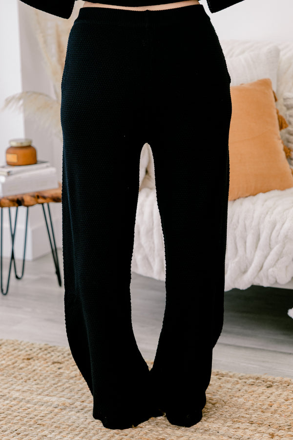Chic Soul Plus size Clothing, black set with pants and a long sleeve top that have a waffle knit texture and the the top has buttons going down to the chest 