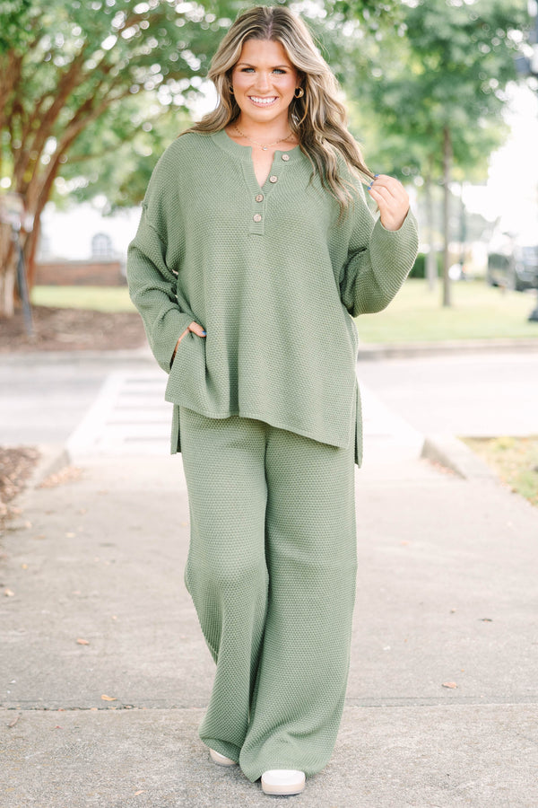 Plus size olive green knit set with a button-down henley top and matching shorts in a relaxed fit.