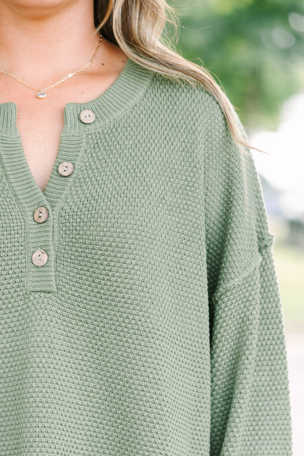 Plus size olive green knit set with a button-down henley top and matching shorts in a relaxed fit.