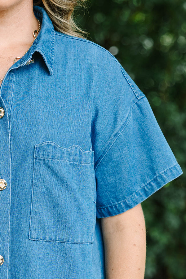 Plus size short-sleeve denim shirt with statement buttons, scalloped pocket, and a relaxed fit.
