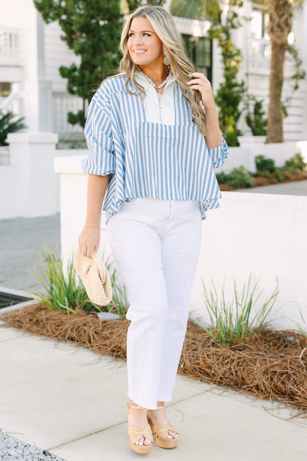 Chic Soul plus size clothing, blue striped top with a zipper detail on the chest outlined by solid white blocking around the neckline and the zipper.
