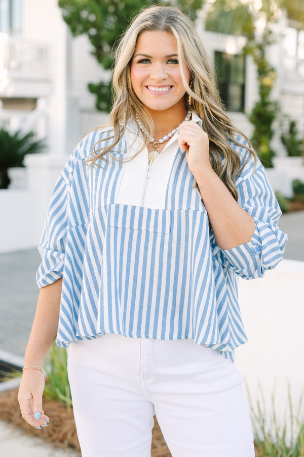 Chic Soul plus size clothing, blue striped top with a zipper detail on the chest outlined by solid white blocking around the neckline and the zipper.
