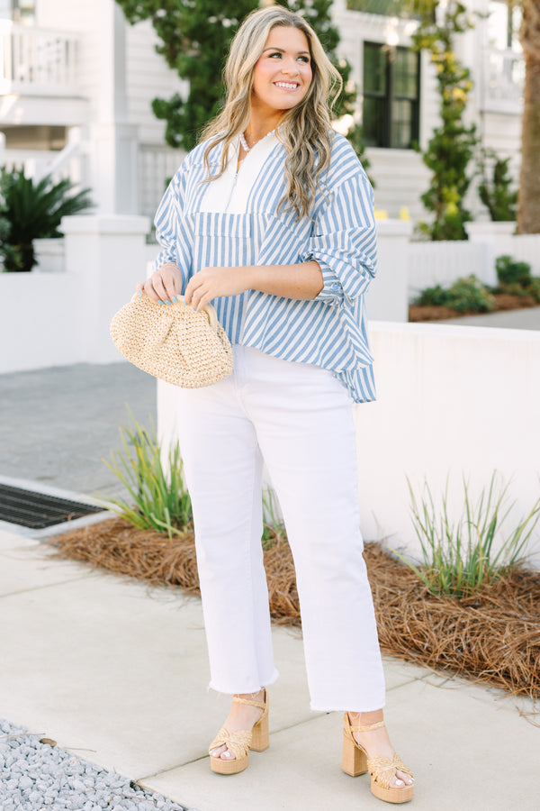 Chic Soul plus size clothing, blue striped top with a zipper detail on the chest outlined by solid white blocking around the neckline and the zipper.
