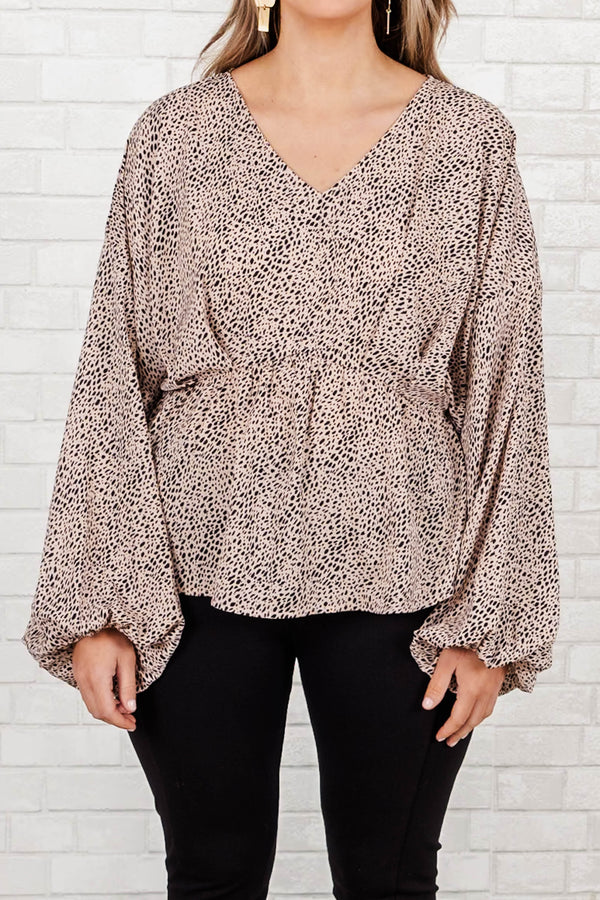Chic Soul Plus size clothing, tan top with v-neck, gathered waist, long flowy sleeves and black spotted print.