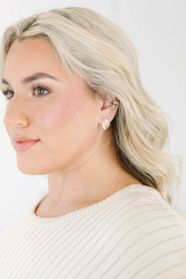 Textured gold leaf-shaped stud earrings