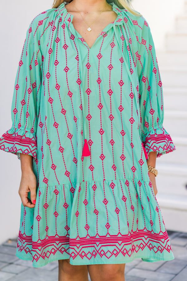 Plus Size teal cotton dress with pink Aztec embroidery, split V-neck, tassels, and flounce hem.