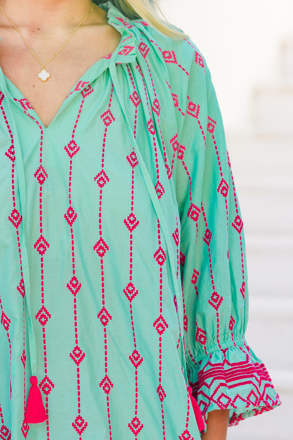 Plus Size teal cotton dress with pink Aztec embroidery, split V-neck, tassels, and flounce hem.
