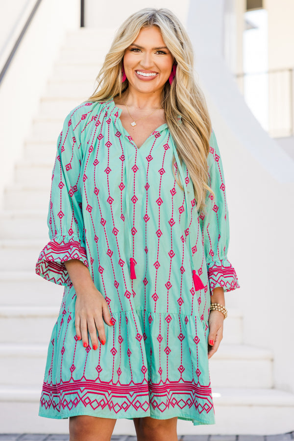 Plus Size teal cotton dress with pink Aztec embroidery, split V-neck, tassels, and flounce hem.
