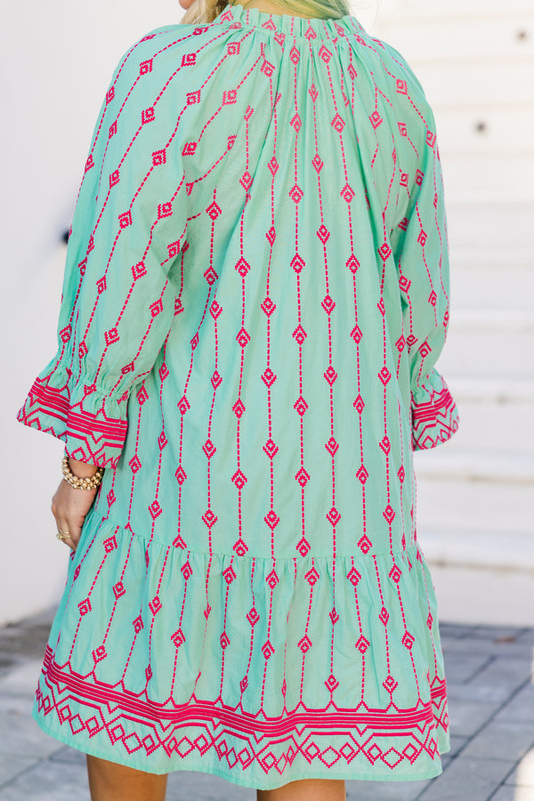 Plus Size teal cotton dress with pink Aztec embroidery, split V-neck, tassels, and flounce hem. 