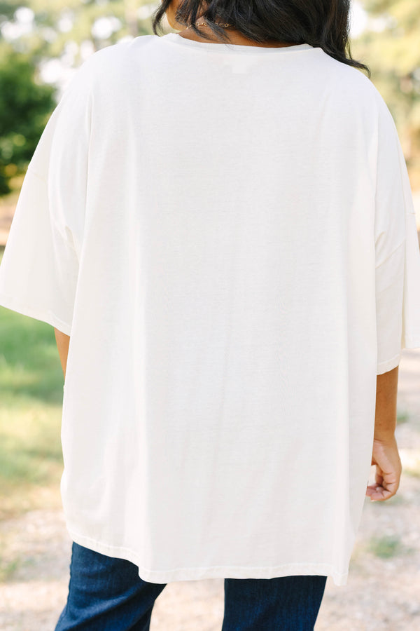 Plus size ivory boyfriend tee with 'HOWDY' and floral cowboy boots in a flowy 100% cotton fit.