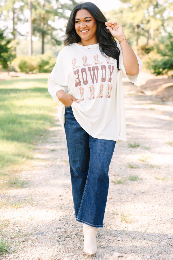 Plus size ivory boyfriend tee with 'HOWDY' and floral cowboy boots in a flowy 100% cotton fit.