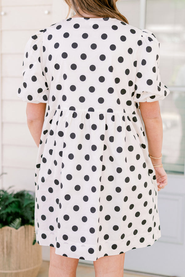 Chic Soul plus size clothing, short-puffed-sleeve white flowy short baby doll dress with black polka dots and black tied bows on the neckline