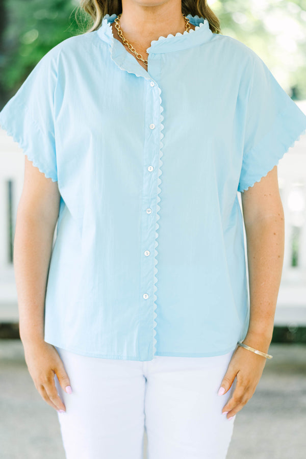 Plus size light blue button-front cotton blouse with scalloped trim on the neckline and sleeves.