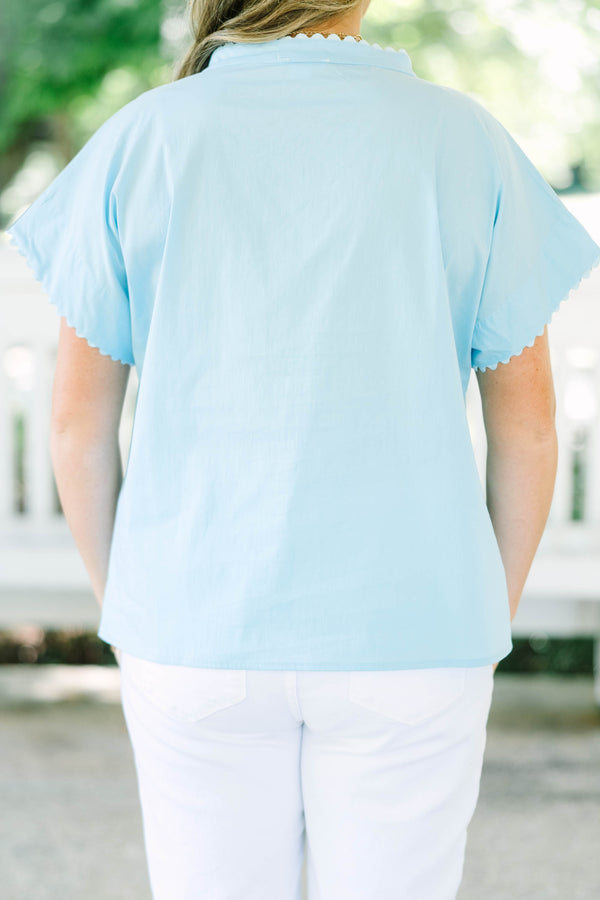 Plus size light blue button-front cotton blouse with scalloped trim on the neckline and sleeves.