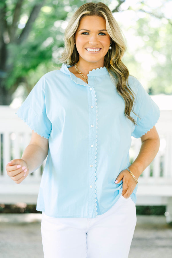 Plus size light blue button-front cotton blouse with scalloped trim on the neckline and sleeves.