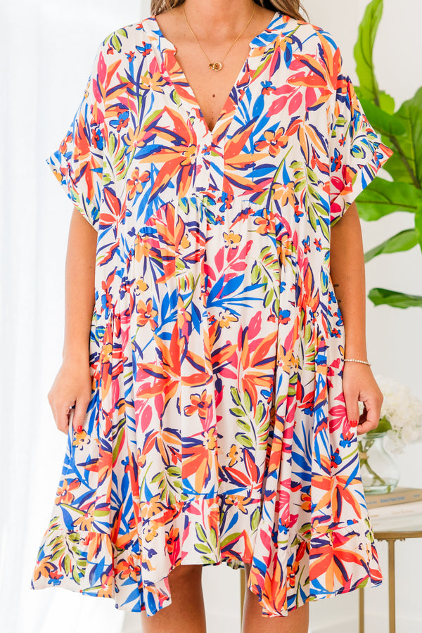 Chic Soul plus size clothing, short sleeve ivory dress with blue, orange, and yellow floral patterns and buttoned v-neckline