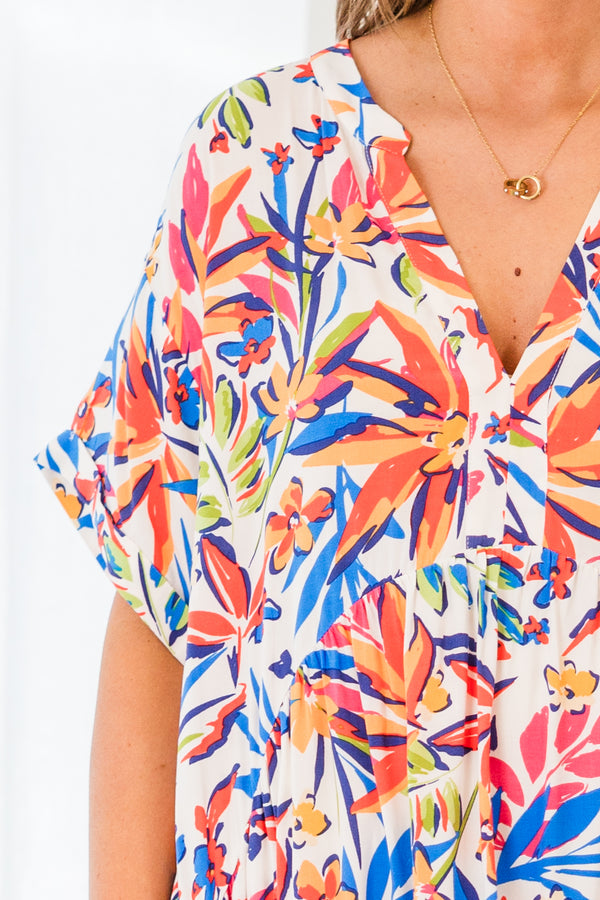 Chic Soul plus size clothing, short sleeve ivory dress with blue, orange, and yellow floral patterns and buttoned v-neckline