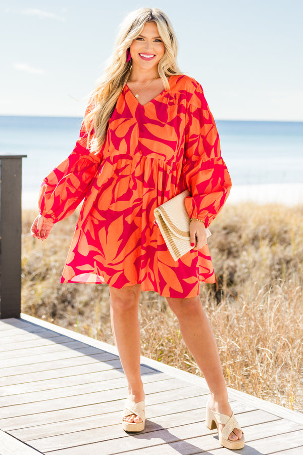Chic Soul plus size clothing, orange long sleeve mini dress with tiered sleeve detail with v neckline and cuff puff sleeves with large abstract pink print