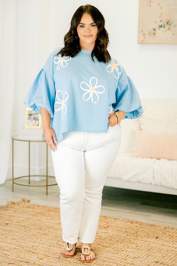 Plus Size light blue top with puff sleeves and three-dimensional white floral embroidery.