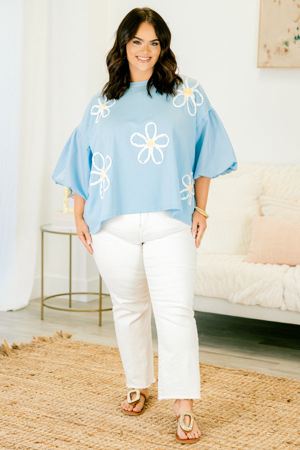 Plus Size light blue top with puff sleeves and three-dimensional white floral embroidery.
