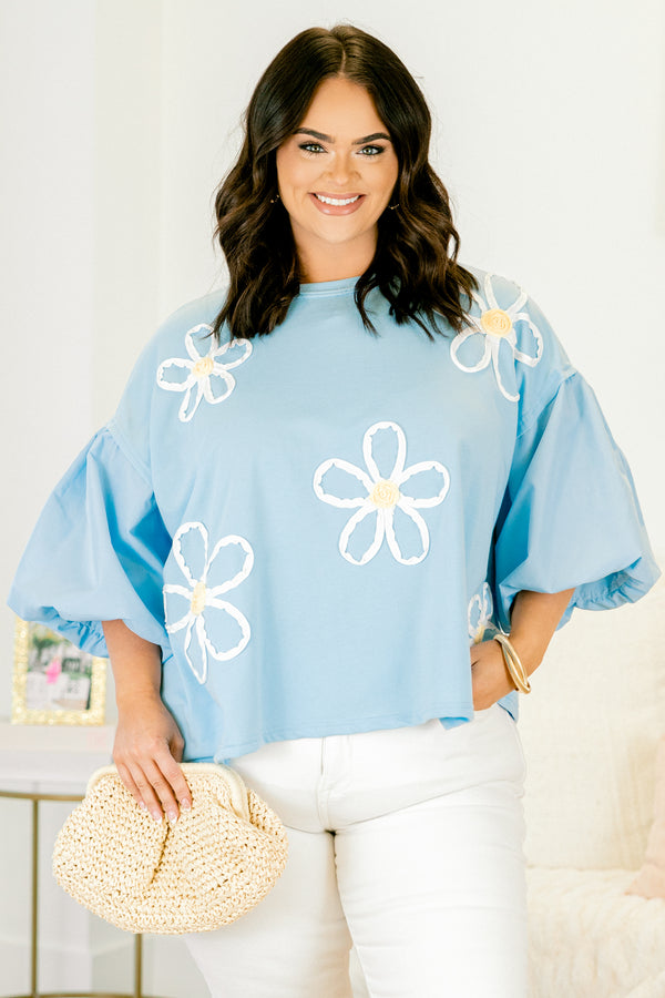 Plus Size light blue top with puff sleeves and three-dimensional white floral embroidery.