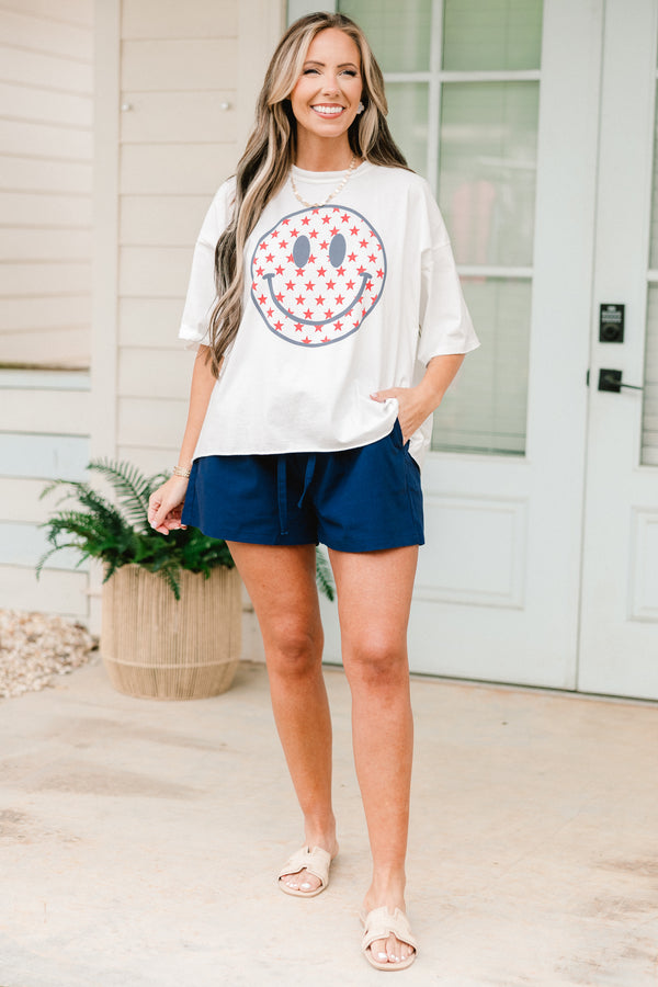 Chic Soul plus size clothing, White short sleeve tee with a smiley face graphic on the center of the shirt that is filled with red stars

