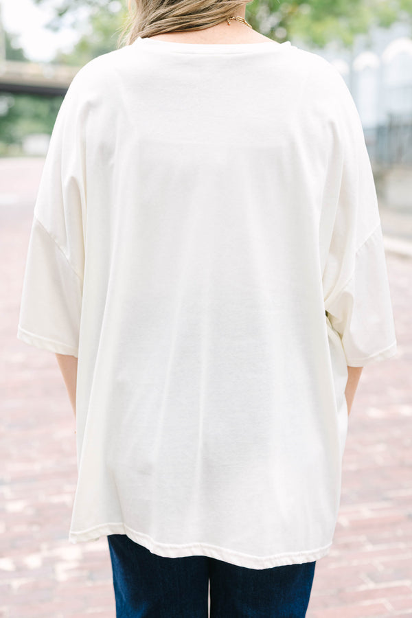 Ivory oversized boyfriend tee with a happy pumpkin graphic 