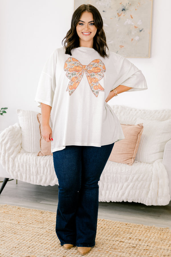 Chic Soul Plus size clothing, ivory graphic tee with a bow in the center of the shirt that is filled with a fall pumpkin pattern