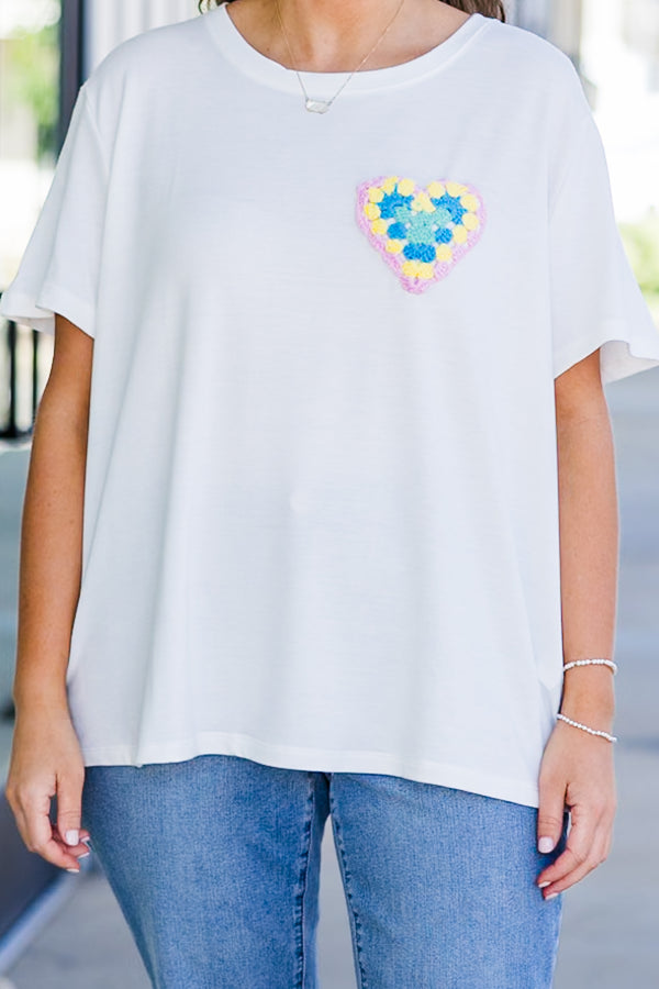 Chic Soul plus size clothing, short-sleeve high-scoop-neckline off-white top with small multi-colored crochet heart on left side of bodice
