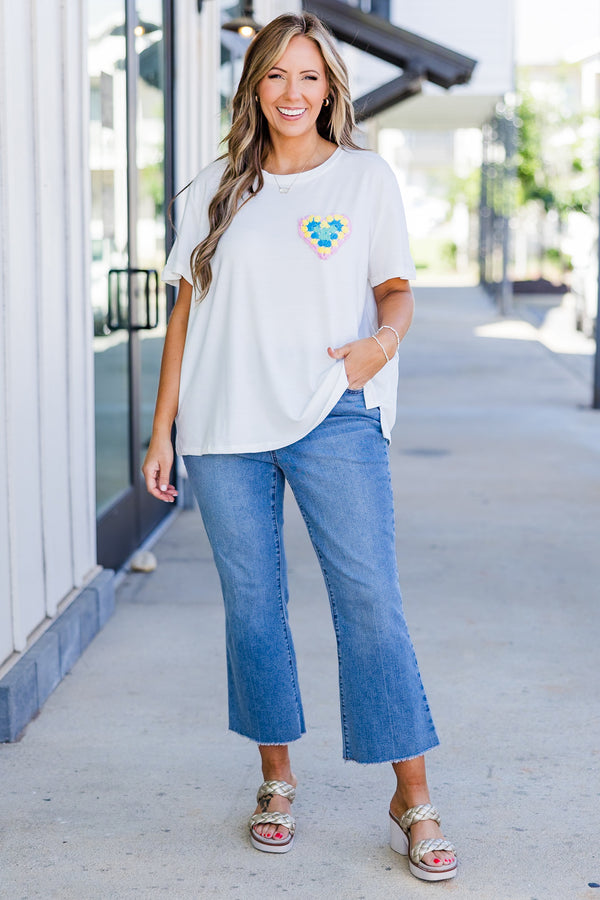 Chic Soul plus size clothing, short-sleeve high-scoop-neckline off-white top with small multi-colored crochet heart on left side of bodice