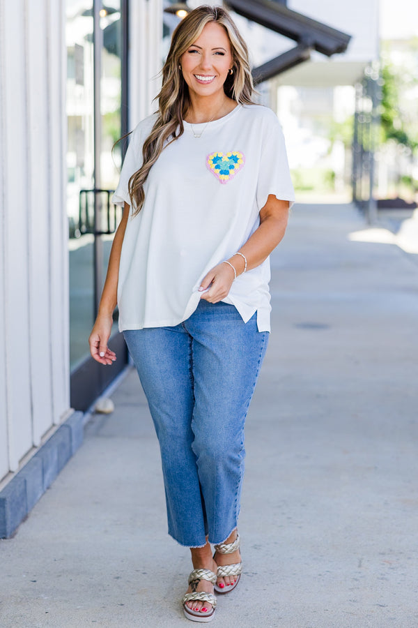 Chic Soul plus size clothing, short-sleeve high-scoop-neckline off-white top with small multi-colored crochet heart on left side of bodice