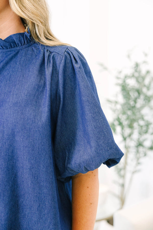 Plus size dark denim top with ruffled collar, button-down front, and elastic bubble sleeves.